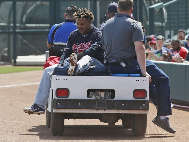 Cleveland Indians' Jose Ramirez is taken off the field on a cart after an injury on Sunday. [AP Photo/Sue Ogrocki]