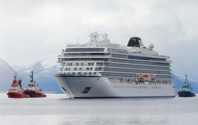 The cruise ship Viking Sky arrives at port off Molde, Norway, Sunday after the problems in heavy seas off Norway's western coast. [Svein Ove Ekornesvag / NTB scanpix via AP]