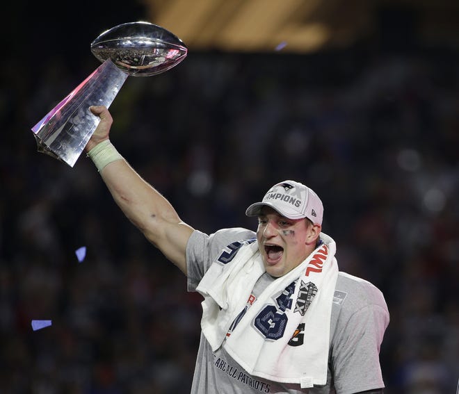 FILE - In this Feb. 1, 2015, file photo, New England Patriots tight end Rob Gronkowski celebrates after the Patriots defeated the Seattle Seahawks in the NFL Super Bowl football game in Glendale, Ariz. Gronkowski says he is retiring from the NFL after nine seasons. Gronkowski announced his decision via a post on Instagram Sunday, March 24, 2019, saying that a few months shy of this 30th birthday ‡¢þÇ¨Åìits time to move forward and move forward with a big smile.‡¢þÇ¨¬ù (AP Photo/Matt Rourke, File)