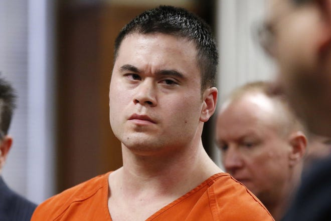 Former Oklahoma City police officer Daniel Holtzclaw is seen Jan. 21, 2016, at a sentencing hearing in Oklahoma City. The Oklahoman reports that the council will vote Tuesday on the proposed settlement between the city, Holtzclaw and plaintiff Demetria Campbell. Campbell alleges that Holtzclaw slammed her against a brick wall in 2013 while on police duty. Holtzclaw is serving a 236-year sentence for rape and other crimes. [AP Photo/Sue Ogrocki, Pool, File]