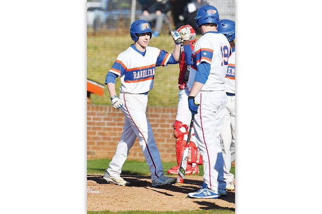 ONE OF MANY - RHS' Dawson Edwards is congratulated after hitting a home run.