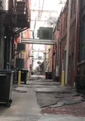 Transformers are suspended over alleys in downtown Burlington. [John Gaines/thehawkeye.com]