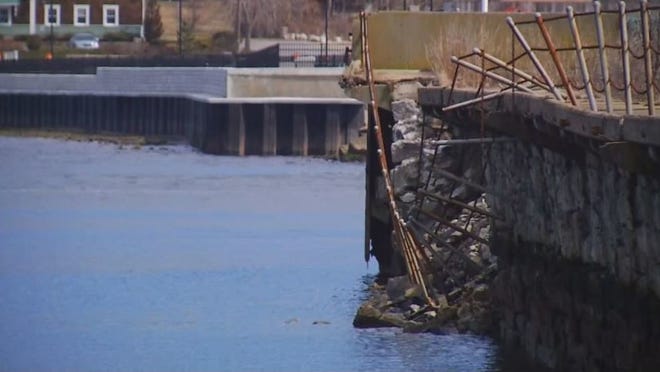 A section of the Stone Bridge abutment on the Portsmouth side eroded and broke off into the water on Friday, according to a Portsmouth police report. [Newport Daily News Photo]