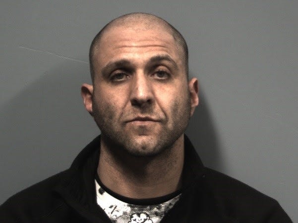 Chad Bornstein, 39, of Randolph is accused of shooting out a bank window Friday night with a BB gun. Police said they now believe he is behind a number of similar vandalism crimes. (Randolph Police Department)