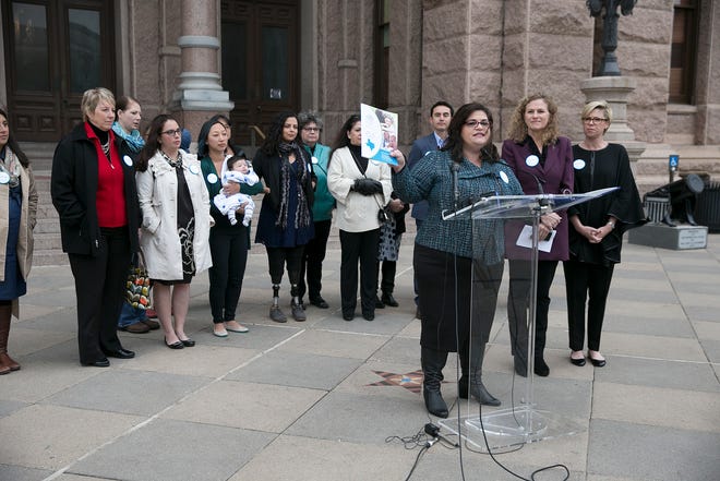 In this Dec. 7, 2016, file photo, Anna Dragsbaek, president and CEO of The Immunization Partnership, holds up a copy of the nonprofit's report on the status of vaccinations in Texas during a news conference at the Capitol. Nearly 50 people in the Capitol received vaccinations after a whooping cough case in the House, bringing immunization battles close to home in a chamber where politically active anti-vaccination groups have moved to claim territory. [Deborah Cannon/American-Statesman]