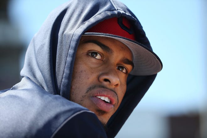 An injured Cleveland Indians shortstop Francisco Lindor watches teammates from the dugout during the second inning of a spring training baseball game against the San Diego Padres, Monday, March 18, 2019, in Goodyear, Ariz. (AP Photo/Ross D. Franklin)