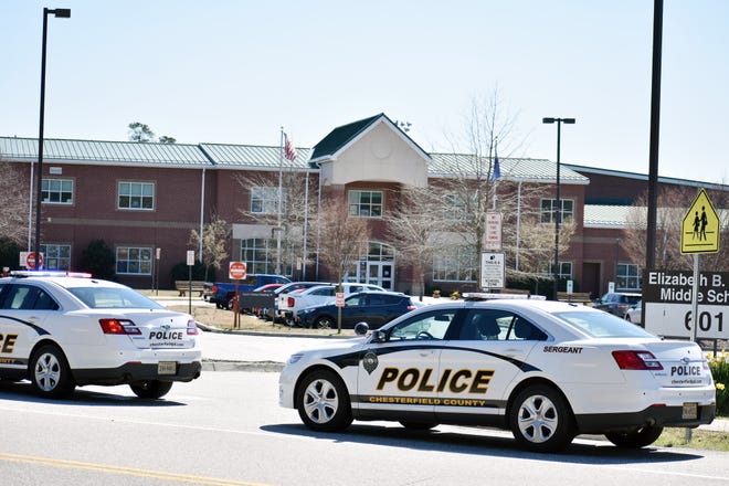 Chesterfield police cruisers sit outside of a locked down Elizabeth B. Davis Middle school after a telephoned threat on March 27, 2019. [Sean Jones/progress-index.com]