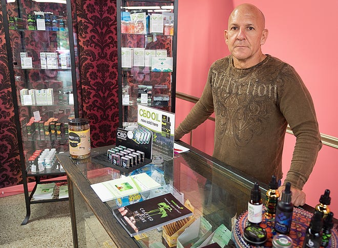 Albi Villaverde, owner of Herbal Health and Wellness, sells CBD products inside Antoinette's Bathhouse on King Street in St. Augustine. CBD was a $591 million industry in 2018 and is expected to grow to $22 billion by 2022, according to market analysis by the Brightfield Group. [PETER WILLOTT/THE RECORD]