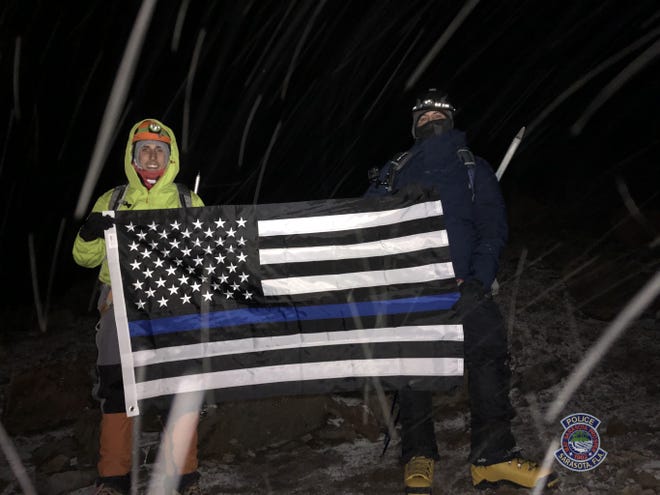 Detective Steve Fergus, right, and Officer Brandon Vermillion of the Sarasota Police Department recently climbed an inactive volcano in Ecuador, one of the tallest points in the world, to rasie awareness for fallen officers. [COURTESTY PHOTO]