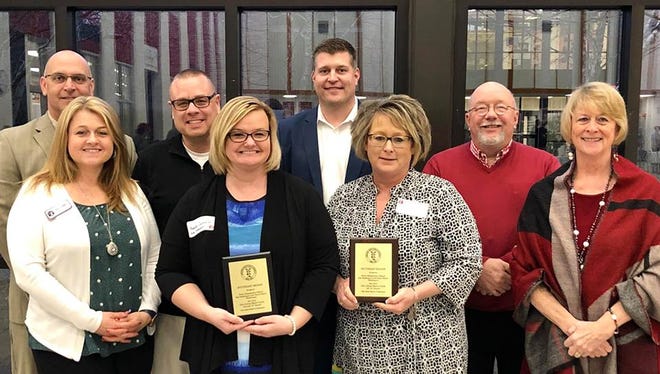 Perry Elementary School received the State Board of Education 2017-2018 Ohio School Report Cards All “A” Award and Overall “A” Award. Meanwhile, East Muskingum Local Board of Education member Matt Abbott was recognized for 10 years of service to the board during the Ohio School Boards Association Southeast Region Spring Conference in Thornville on March 26 at Sheridan High School. Pictured, from left, front row, are Shala Zemba, board of education member; Annette Calendine, Title 1 teacher at Perry Elementary School; Leigh Ann Atkins, Perry Elementary School principal; Gail Requardt, board of education member; and back row, Dave Adams, East Muskingum Schools’ superintendent; Mike Mathers, Matt Abbott and Ken Blood, board of education members.