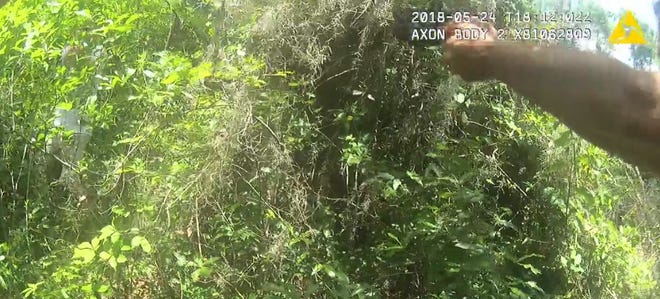 This screen shot from the deputy body camera shows Dustin Odom, in white, to the left. [Marion County Sheriff's Office]