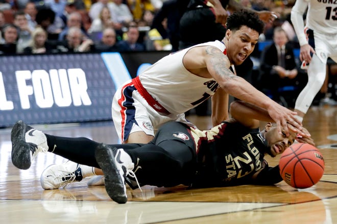 Gonzaga forward Brandon Clarke vies for a loose ball with Florida State guard M.J. Walker on Thursday in an NCAA West Region semifinal in Anaheim, Calif. [Marcio Jose Sanchez/The Associated Press]
