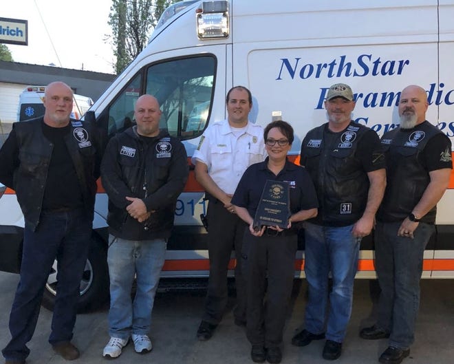 NorthStar EMS paramedic Sara Haggerty received the First Responder of the Month award for March from the the Tuscaloosa chapter of Punishers Law Enforcement Motorcycle Club. [Submitted photo]