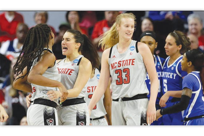 Having FUN — N.C. State’s Aislinn Konig, center, hugs DD Rogers, left, during the 
Wolfpack’s second-round NCAA Tournament win over Kentucky on Monday.