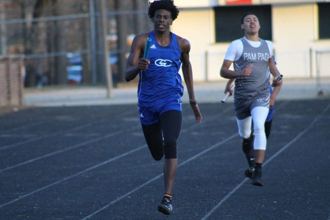 Greene Central's Zakvil Smith finishes his leg of the 4X400 relay. The junior won the high jump and the 400 meter dash to help the Rams finish second at the four-team conference meet in Washington. [Laieke Abebe/The Free Press]