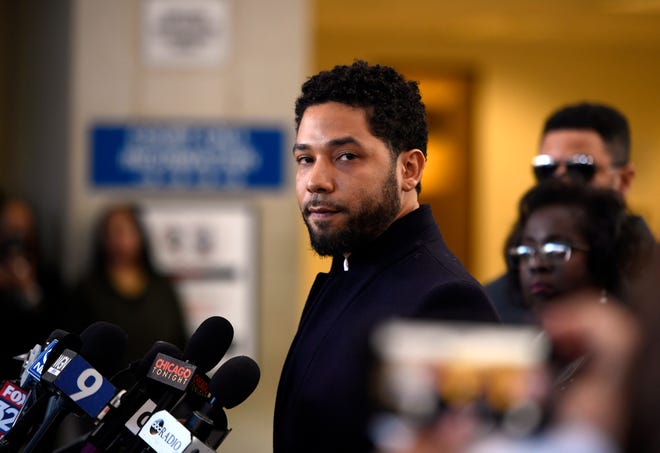 Actor Jussie Smollett talks to the media before leaving Cook County Court after his charges were dropped Tuesday in Chicago. [Paul Beaty/THE ASSOCIATED PRESS]