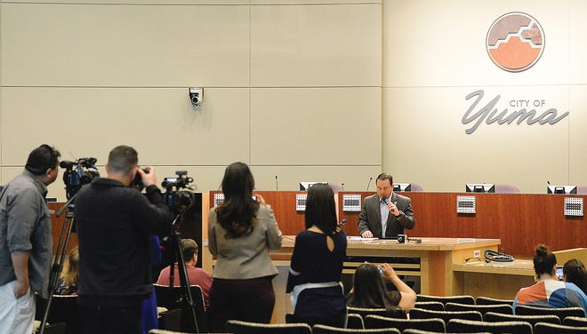 Yuma Mayor Doug Nicholls speaks to the media and audience during a news conference inside Yuma City Council Chambers about the current humanitarian crisis in the border region due to high volumes of illegal migrant crossings Thursday, March 28, 2019, in Yuma, Ariz. Nicholls said the city is working with various non-governmental organizations to make sure the families have temporary housing, food, medical care and help with travel to their intended destinations. (Randy Hoeft/The Yuma Sun via AP)