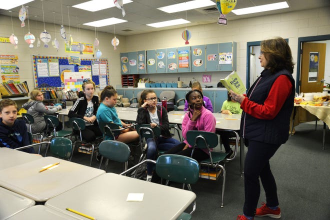 Each month, Destin middle school teacher Leah McGill chooses a different book for her book club students to read. This month the book was "Hound Dog True." [SAVANNAH VASQUEZ/DAILY NEWS]