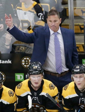 Bruins head coach Bruce Cassidy gestures to pull the goalie late during the third period of Saturday’s game against the Florida Panthers. Boston lost, 4-1. [AP / Mary Schwalm]