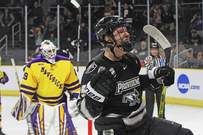 PC's Josh Wilkins celebrates after scoring on Minnesota State goaltender Dryden McKay in the first period on Saturday at the Dunkin' Donuts Center. It cut the Mavericks' lead to 3-1 at the time and was the first of six straight goals by Friars in the 6-3 victory. [The Providence Journal / Steve Szydlowski]