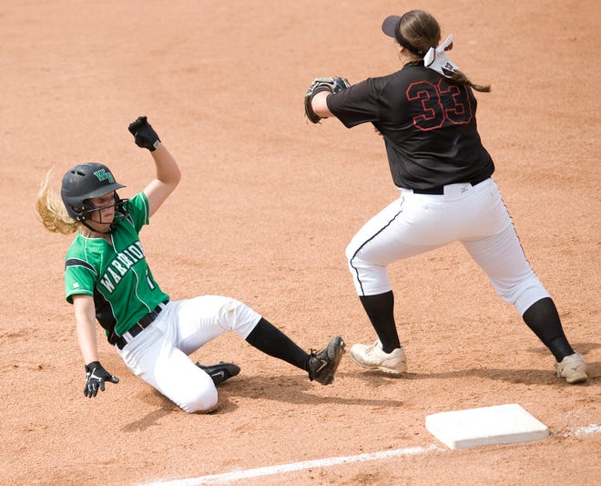 West Branch's Grace Heath slides safely into third base after hitting a triple in the Division II state semifinal game against Jonathan Alder in May 2018. Michael Skolosh, Special to The Review