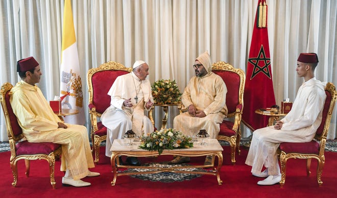 Pope Francis, centre left is received by Morocco's King Mohammed VI centre right, his son Crown Prince Moulay Hassan right, and brother Prince Moulay Rachid, left, in Rabat, Saturday. Pope Francis has arrived in Morocco for a trip aimed at highlighting the North African nation's tradition of Christian-Muslim ties, while also letting him show solidarity with migrants at Europe's door and tend to a tiny Catholic flock. [Fadel Senna/AP Photo]