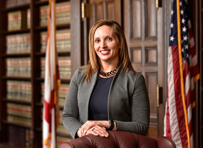 Lara Mattina is seen in the law library at the 4th Judicial Circuit State Attorney's Office, where she is the new director of the Circuit Court. [Will Dickey/Florida Times-Union]
