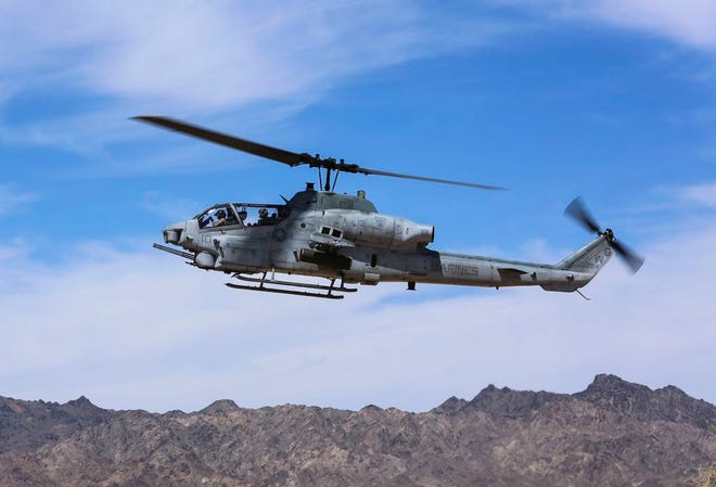 In this April 17, 2017 photo released by U.S. Marine Corps, an AH-1Z Viper prepares to land at the Chocolate Mountain Aerial Gunnery Range, Calif. A statement from the Marine Corps Air Station posted on Facebook Saturday, March 31, 2019, says two pilots have died on an AH-1Z Viper helicopter crash, while conducting a routine training mission near Yuma, Ariz. The accident occurred at about 8:45 p.m. Saturday.