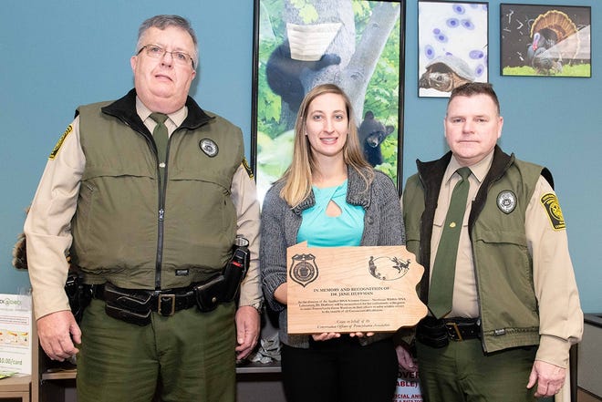 The Pennsylvania Game Commission donates $250 in honor of the late Jane E. Huffman. Pictured from left are: William McGlone, deputy game warden; Nicole Chinnici, director of Northeast Wildlife DNA Laboratory; and Daniel Figured, Northeast region director of the Pennsylvania Game Commission. [PHOTO PROVIDED]