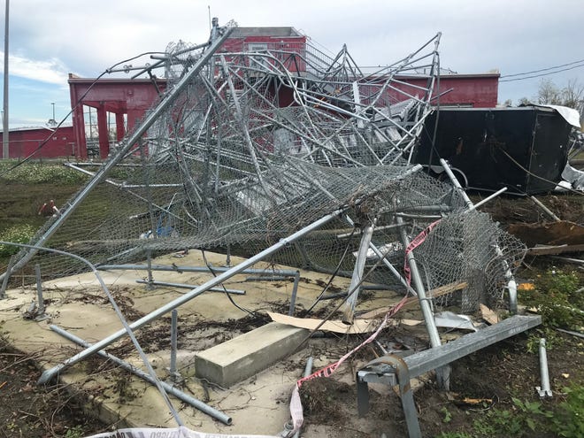 The mangled metal in the foreground is what's left of the band tower, used for rehearsals at Bay High in Panama City. The trailer behind the tower and a shed, not shown, were used to store the band's marching percussion, which is how the band lost all their marching percussion. Photographed shortly after Hurricane Michael hit. [Submitted]