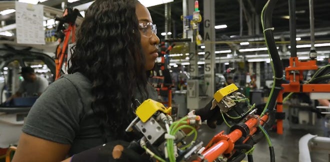 A worker on the line at General Motors's Orion Township, Michigan, assembly plant where the Bolt EV is built. [GM]
