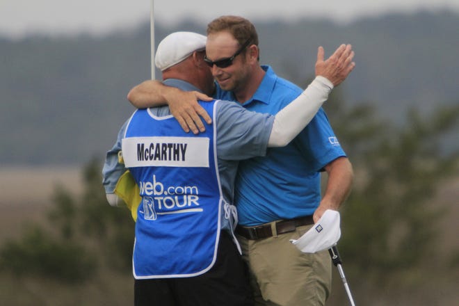 Dan McCarthy, right, hugs his caddie after winning the Savannah Golf Championship on Sunday at The Landings Club's Deer Creek Course. [PHILIP HALL/SAVANNAHNOW.COM]