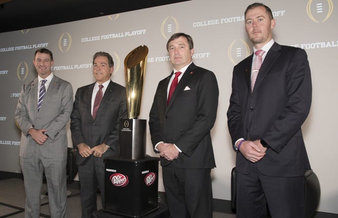 The coaches of the four teams in the College Football Playoff, Lincoln Riley, right, of Oklahoma; Kirby Smart, second from right, of Georgia; Nick Saban, of Alabama; and Dabo Swinney, left, of Clemson, pose together before the College Football Awards show at the College Football Hall of Fame, Thursday, Dec. 7, 2017, in Atlanta. (AP Photo/John Amis)