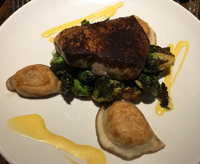 Square 22's char-crusted swordfish comes with brussels sprouts, pierogies and a Tabasco-lime vinaigrette sauce. [LYNNE SHERWIN/BEACON JOURNAL/OHIO.COM]