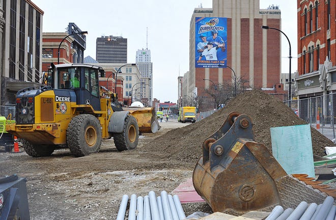 Crews work to get Main St. cleaned up enough for the RubberDucks' baseball game later this week on Tuesday, April 2, 2019 in Akron, Ohio. (Jeff Lange/Beacon Journal/Ohio.com correspondent)