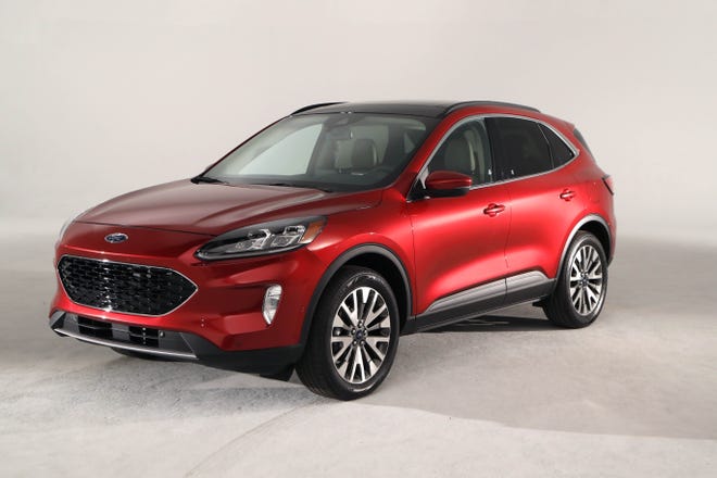 This March 25, 2019, photo shows the new Ford 2020 Escape in Warren, Mich. Ford is hoping to regain a dominant position in the compact SUV segment when it rolls out a revamped version of the Escape this fall. (AP Photo/Carlos Osorio)