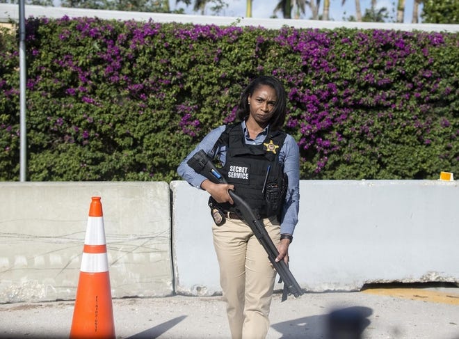 A Secret Service agent stands guard outside Mar-a-Lago in Palm Beach, Fla. [BRUCE R. BENNETT/PALM BEACH POST]