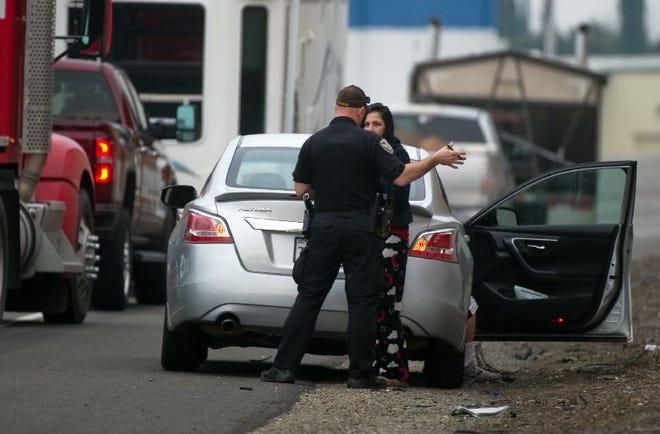 A Manteca police officer questions a witness at the scene of an officer-involved shooting on Highway 99 near Lathrop Road in Manteca on Feb. 15, 2017. [CLIFFORD OTO/THE RECORD FILE 2017]