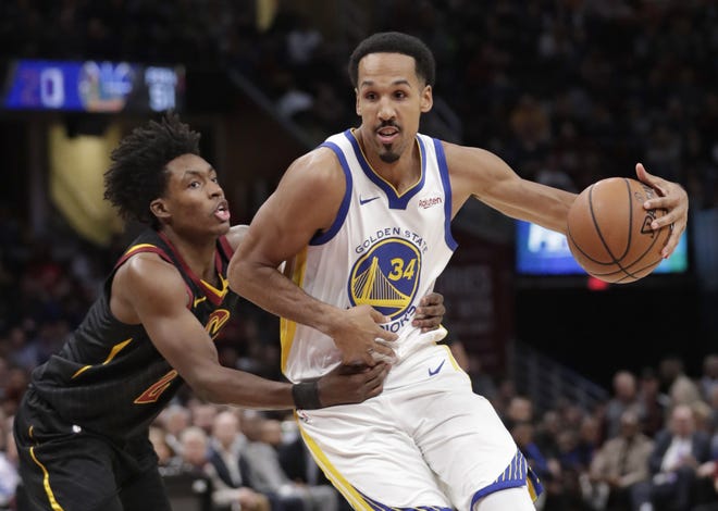 Golden State Warriors' Shaun Livingston (34) drives past Cleveland Cavaliers' Collin Sexton (2) in the second half of an NBA basketball game, Wednesday, Dec. 5, 2018, in Cleveland. The Warriors won 129-105. (AP Photo/Tony Dejak)
