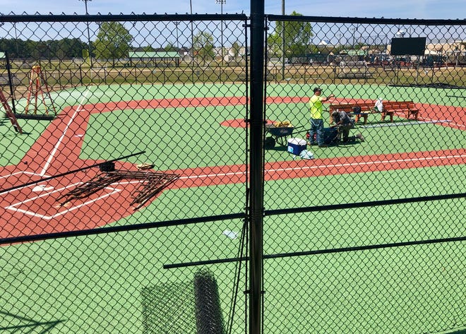 The finishing touches are being put in place at Tiger Point Park in time for Miracle League's first pitch April 27. [DUWAYNE ESCOBEDO/DAILY NEWS]