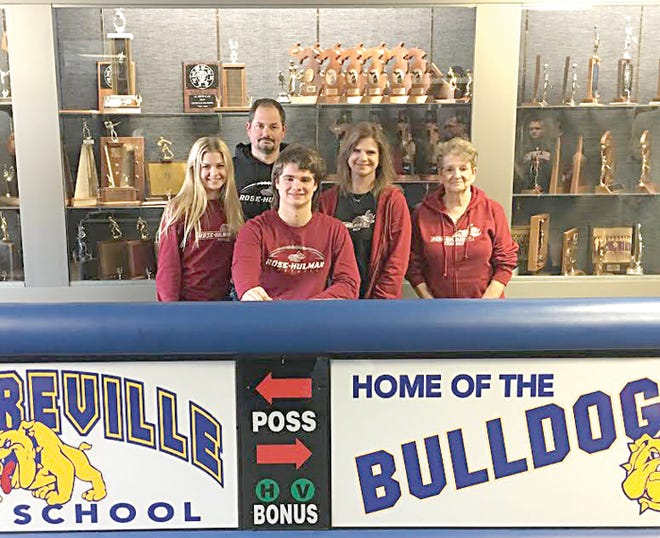 Centreville’s Kyzer Bowen is surrounded by family members as he signs his letter of intent to play football at Rose-Hulman Institute of Technology.