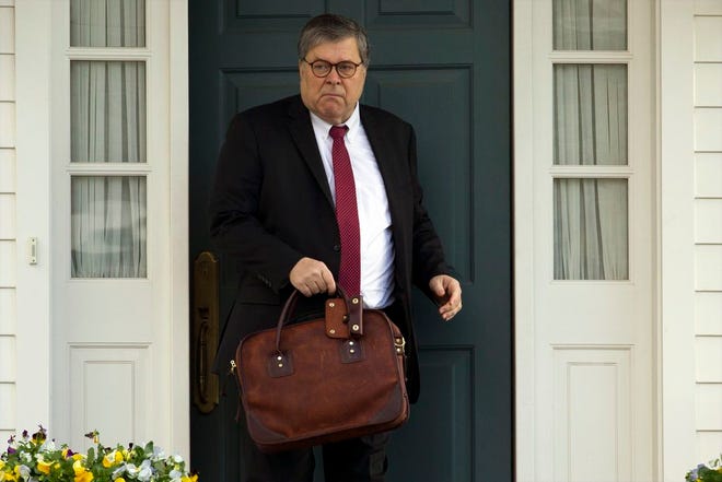 In this March 22, 2019, file photo, Attorney General William Barr leaves his home in McLean, Va. Barr told Congress on March 29, to expect version of special counsel's Russia report by mid-April.