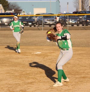 Dawsyn Hartman throws out a runner at first base during the Lady Leafs’ win over Moline.