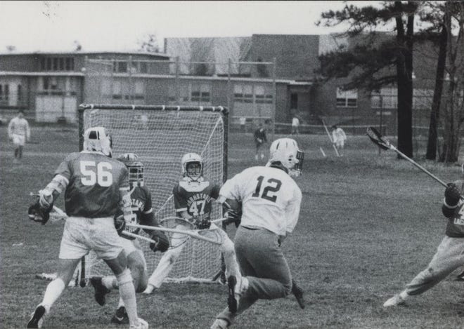 Barnstable defenders protect the goal against a Falmouth scoring attempt in April 1989 high school lacrosse action. [BARNSTABLE PATRIOT FILES/W.B. NICKERSON CAPE COD HISTORY ARCHIVES]