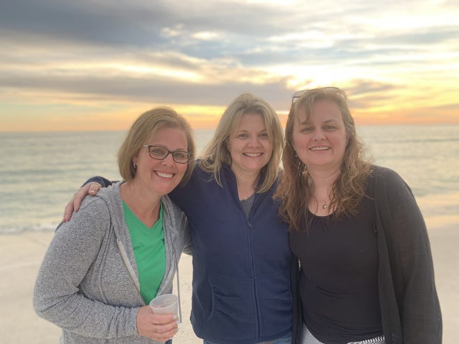 Sisters Liz Ellis, Christine Leary and Katie Paquin, left to right, all of whom were diagnosed with breast cancer over a one year period, discovered they shared the same PALB2 gene. The three also underwent double mastectomies. [Photo courtesy of Liz Ellis]