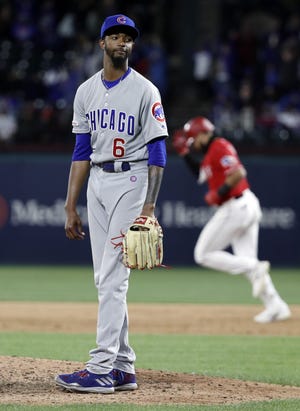 the Chicago Cubs' Carl Edwards Jr. looks to the plate as Texas Rangers' Joey Gallo rounds the bases on his three-run home run off of Edwards during the eighth inning of a baseball game in Arlington, Texas,on March 30. [AP Photo/Tony Gutierrez]