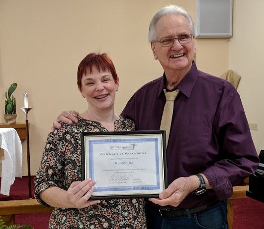 The Very Reverend Carla McCook, rector of St. Margaret of Scotland Episcopal Church in Sarasota, presents Grand Ole Opry recording artist Duane Dee with a Certificate of Appreciation following the dinner and a show at St. Margaret's on March 29. [PROVIDED PHOTO]