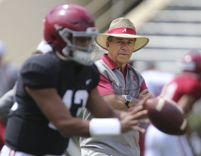 Alabama head coach Nick Saban watches as quarterback Tua Tagovailoa takes a snap during practice. The Crimson Tide holds its second scrimmage of the spring on Saturday at Bryant-Denny Stadium. The annual A-Day game is next Saturday. [Staff Photo/Gary Cosby Jr.]