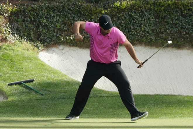 Patrick Reed reacts to his birdie on the 12th hole during the fourth round at the Masters golf tournament in Augusta, Ga. Reed will try to become the first back-to-back Masters champion since Tiger Woods in 2002. [David J. Phillip/AP Photo]