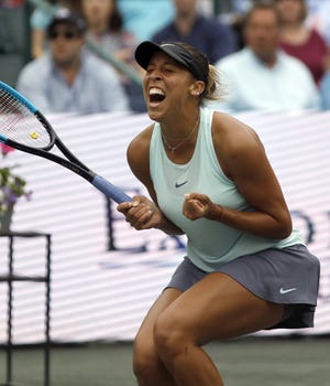 Madison Keys celebrates after defeating Caroline Wozniacki in the finals match Sunday at the Volvo Car Open in Charleston, S.C. [MIC SMITH/THE ASSOCIATED PRESS]